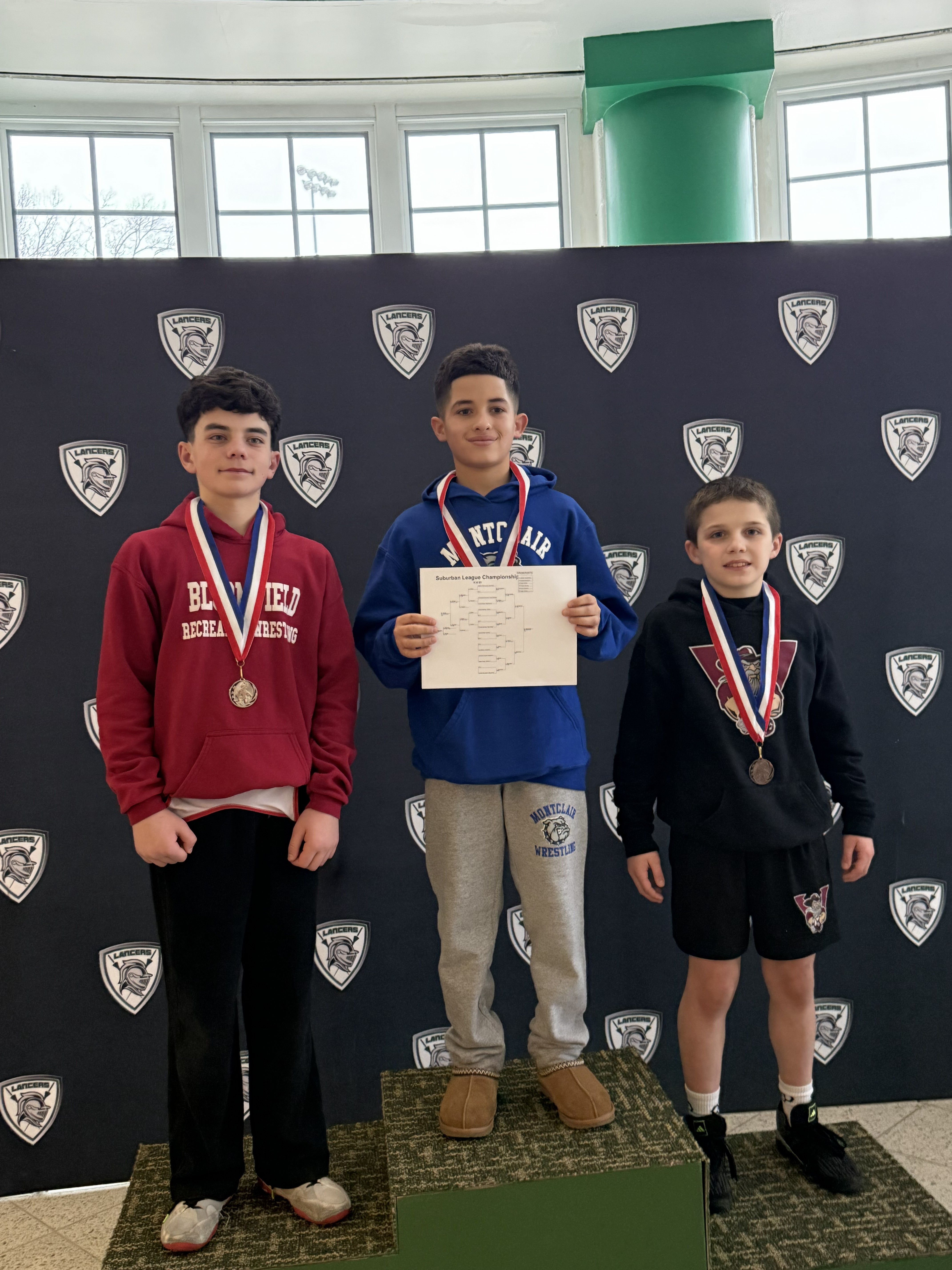 Quincy celebrating a third-place finish